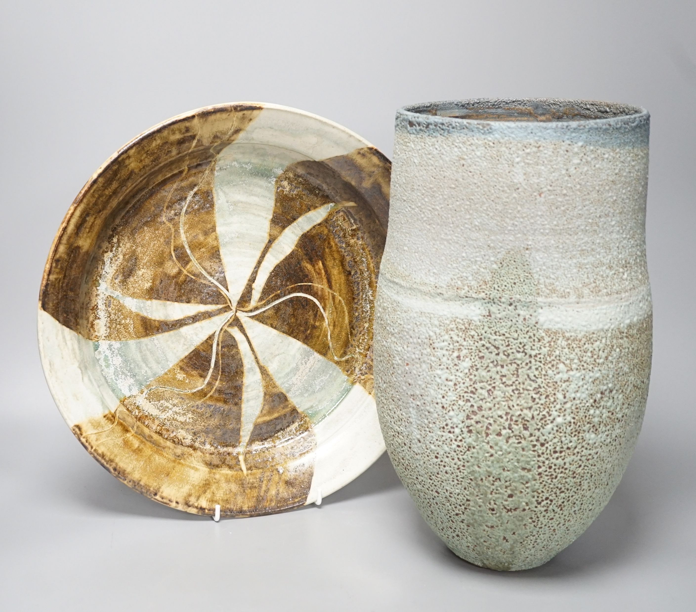 A large raku studio pottery vase, height 33cm, and a stoneware dish